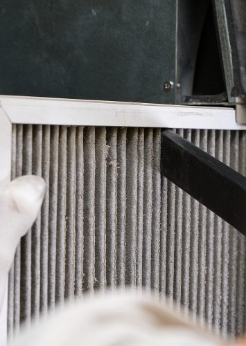 hvac filter replacing. Replacing the filter in the central ventilation system, furnace. Replacing Dirty Air filter for home central air conditioning system. Change filter in rotary heat exchanger recuperator.